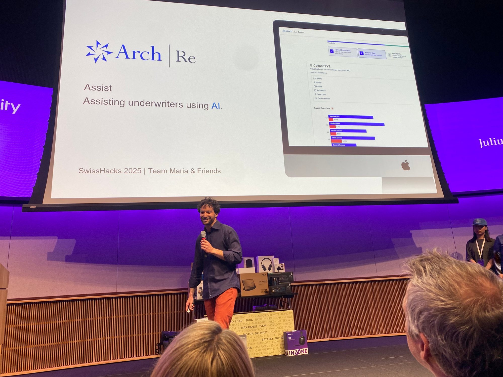 Simone pitching Assist on the SwissHacks stage